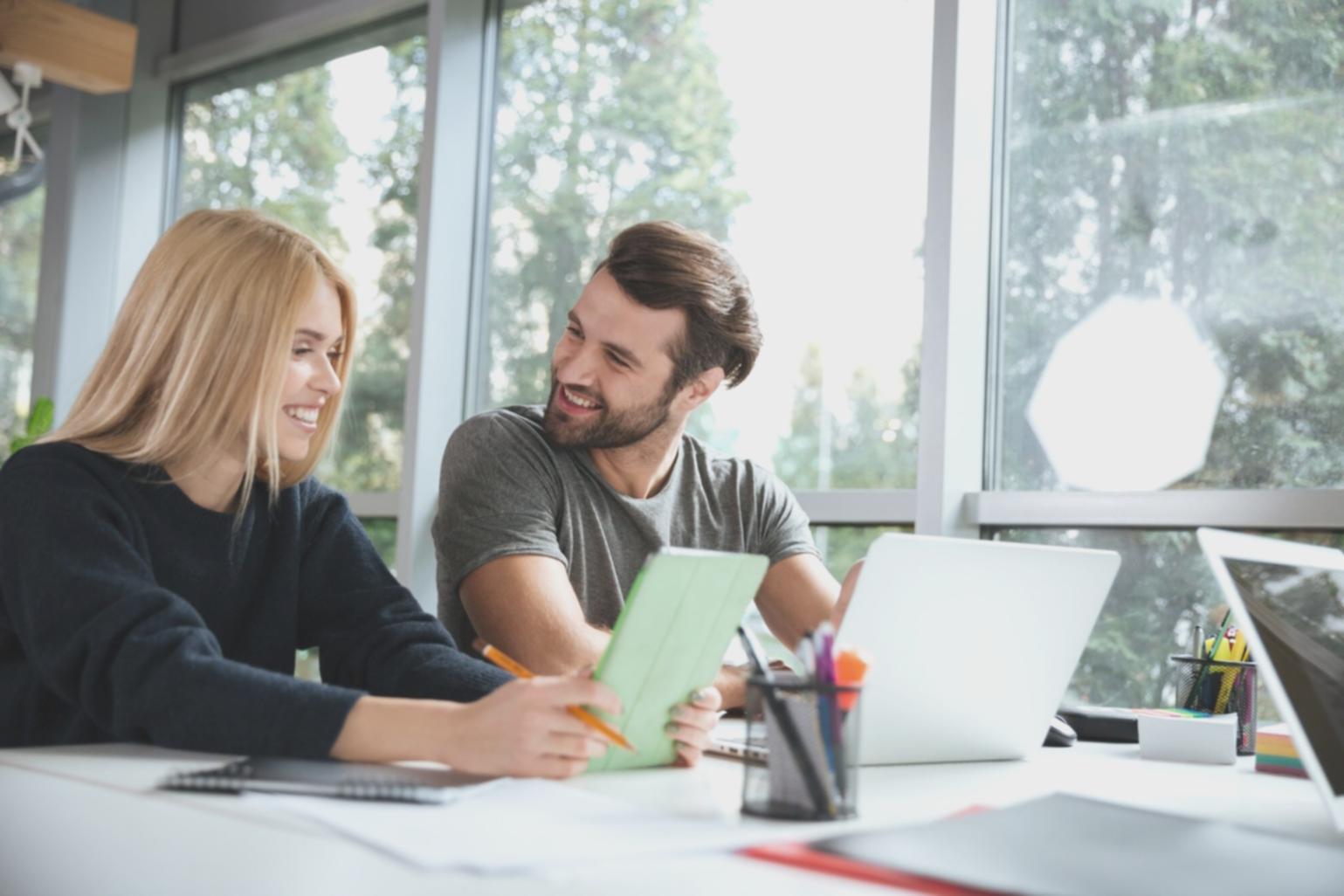 Students engaged in a financial workshop with an instructor using interactive learning methods